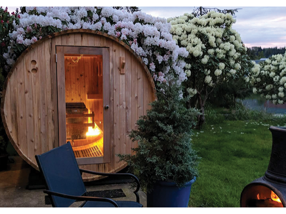 sauna-barrel-outdoors-with-campfire
